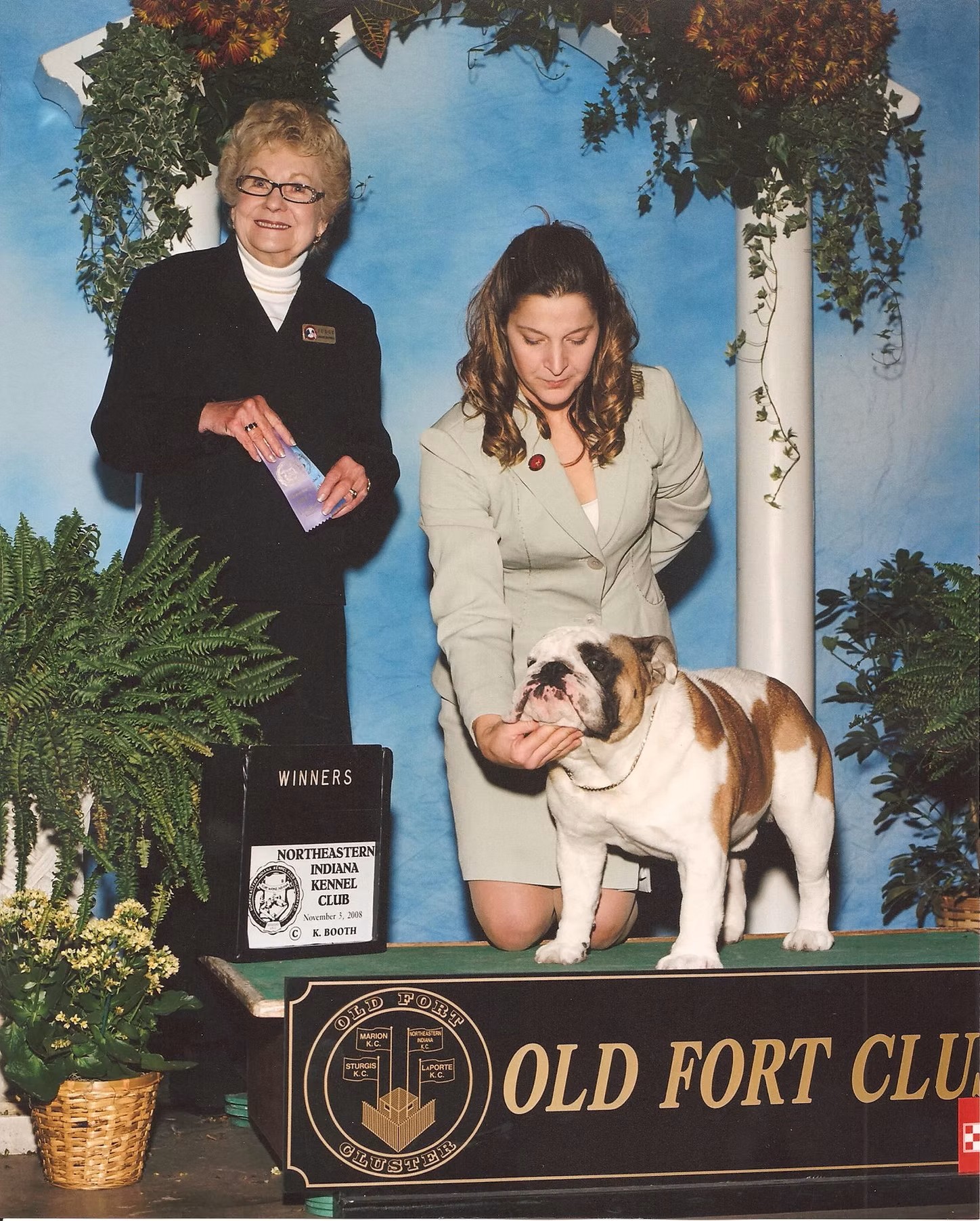 Bulldog With Show Judge and Owner
