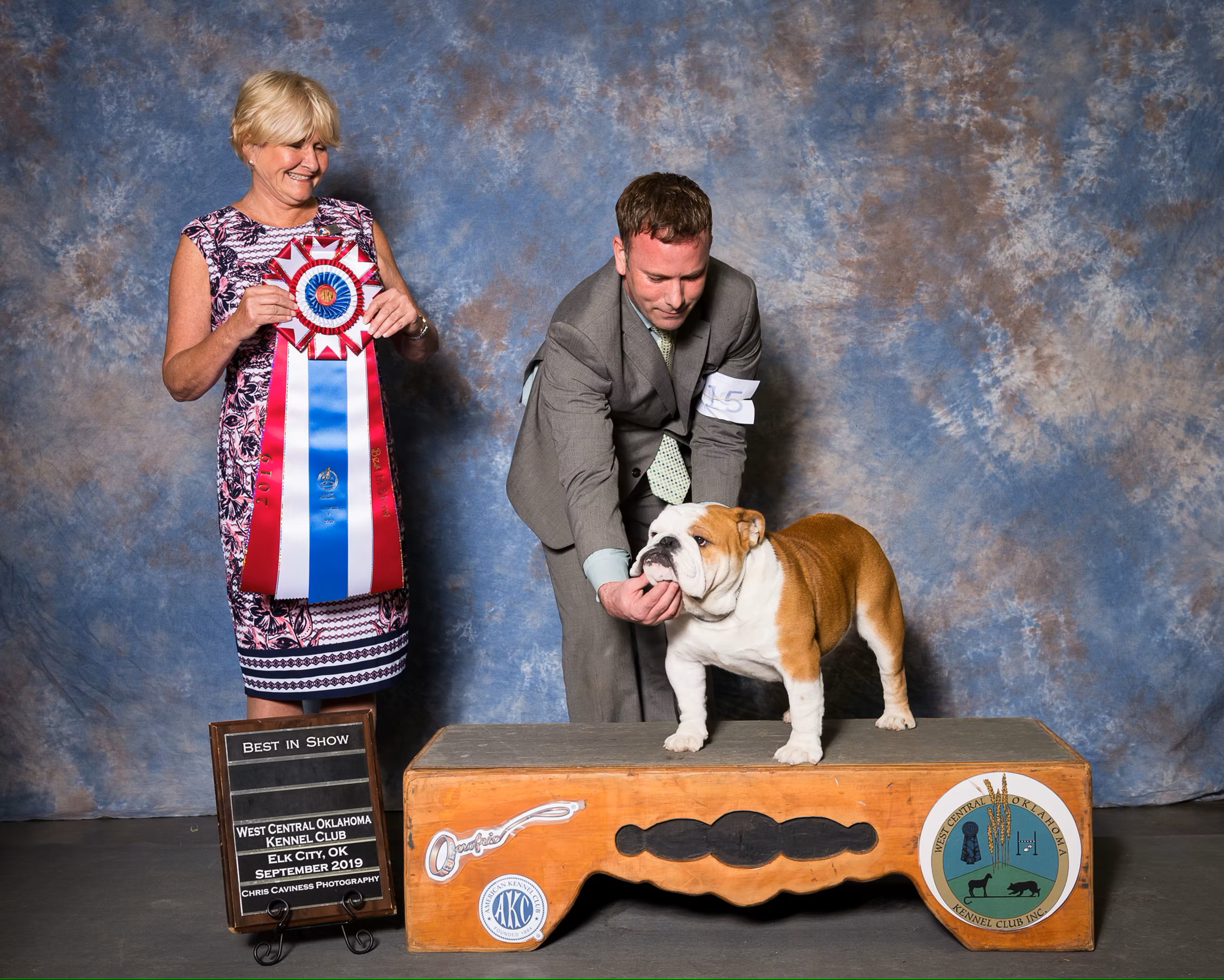 Bulldog With Show Judge and Owner