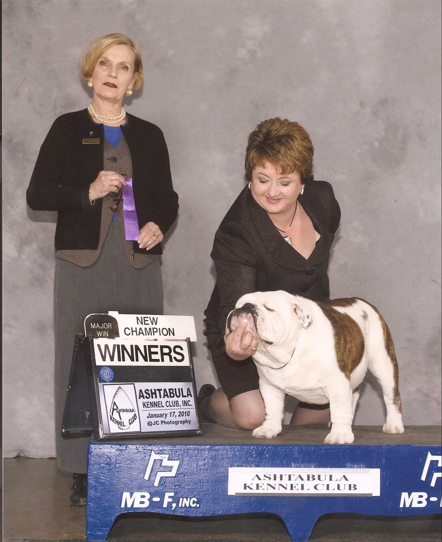 Bulldog With Show Judge and Owner