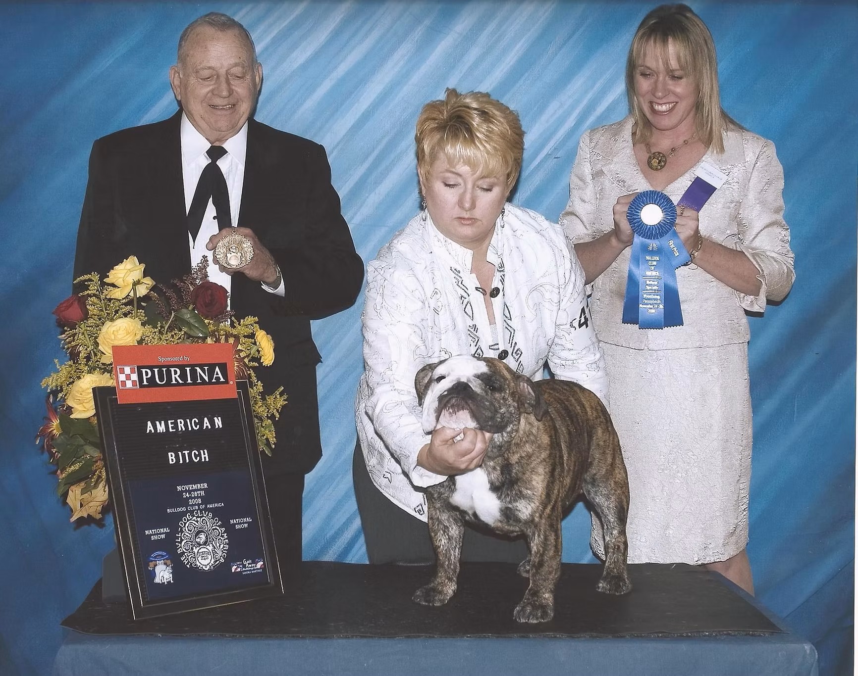 Bulldog With Show Judges and Owner
